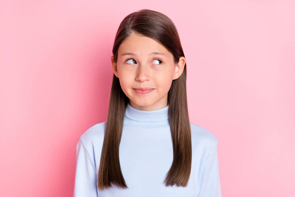 Portrait of attractive cheery bewildered girl overhinking copy space isolated over pink pastel color background - Foto, Imagem