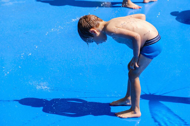 Water summer child fun fountain,  cheerful. - Фото, изображение