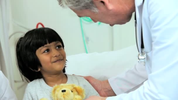 Child patient playing with teddy bear in hospital - Footage, Video
