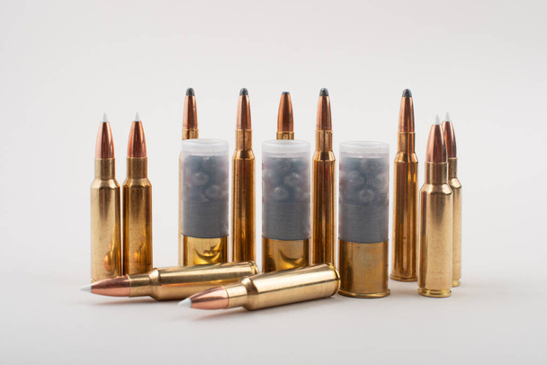 Diffrent type of rifle bullets isolated on grey background. - Foto, Imagen