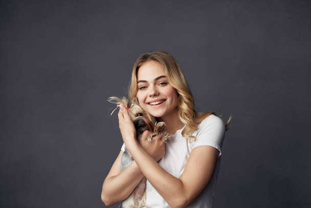 pretty woman with  a small dog  in Studio cropped view. High quality photo - Foto, Imagem