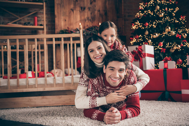 Photo of people lay floor kids enjoy childhood x-mas miracle time wear sweater in decorated apartment indoors - Foto, afbeelding