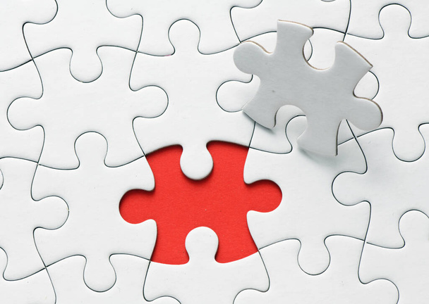 Red jigsaw puzzle pieces on red background. Copy space and business concept - Foto, immagini