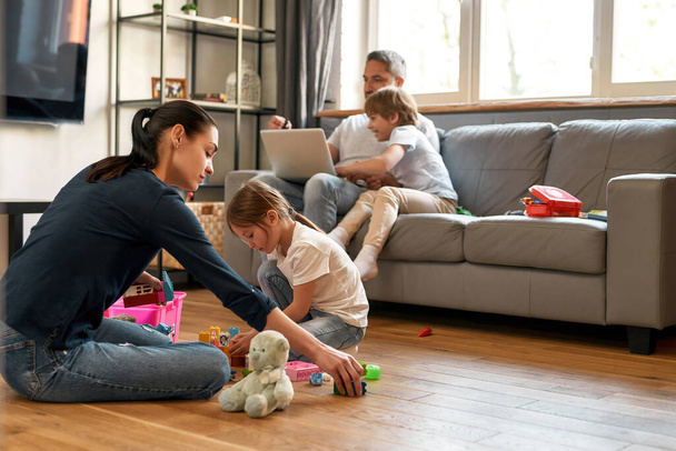 Young Caucasian family relax at home with kids - Valokuva, kuva