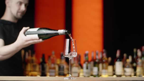Barman pours sparkling wine to the wine glass at the bar counter in slow motion, Full HD 240 fps Prores HQ - Footage, Video