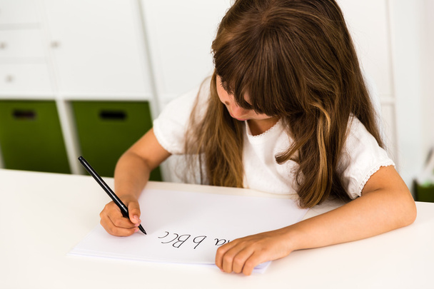 Girl writing the ABC alphabet - Foto, Imagen