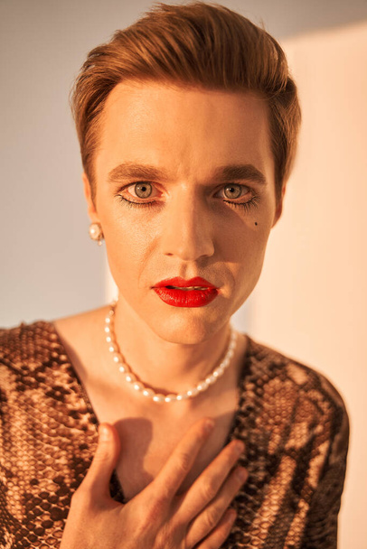 Transgender person looking at the camera, while posing isolated in studio - Photo, image
