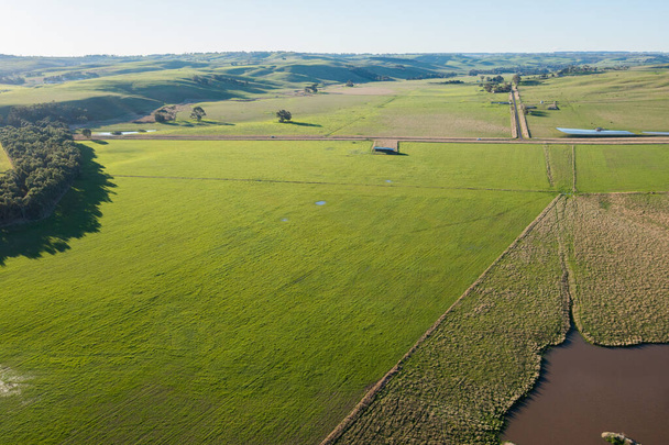 drone shot of farming landscape on a ranch in Australia, of a flooding river. - Photo, Image