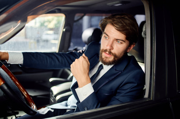 businessmen Driving a car trip luxury lifestyle communication by phone - Foto, Imagem