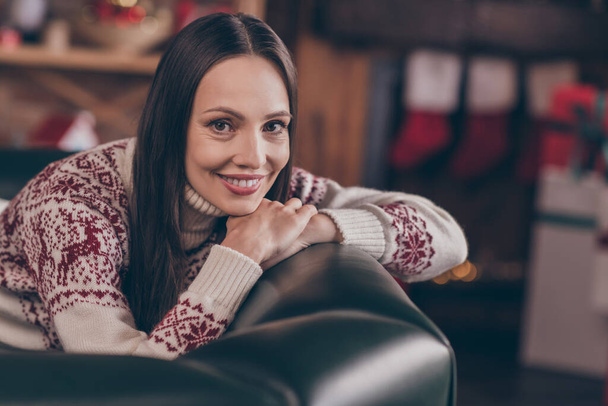 Photo of lovely funky young lady sit rest on couch wear ugly sweater new year at home - Φωτογραφία, εικόνα