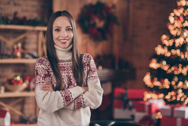 Photo of cool nice mature lady crossed arms near tree wear ugly sweater new year at home - Foto, imagen