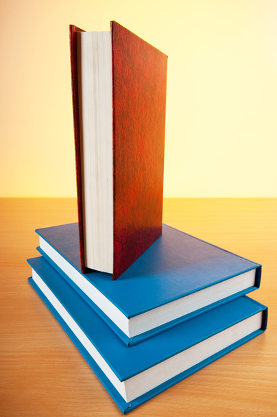 Stack of text books against gradient background - Photo, Image