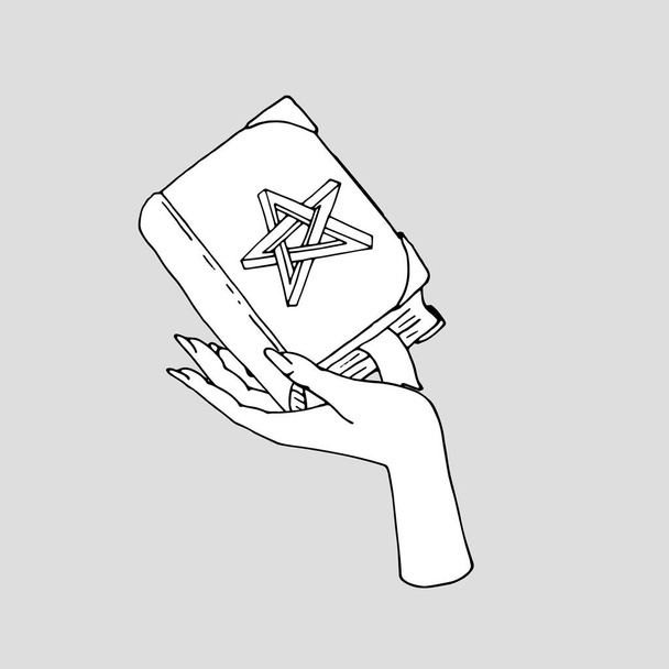 Винтажная мистическая книга с невозможной звездой на обложке в женской руке - Вектор,изображение