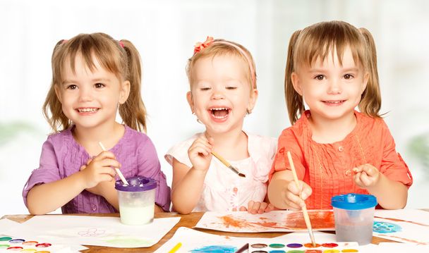 happy little girl in kindergarten draw paints - Photo, Image