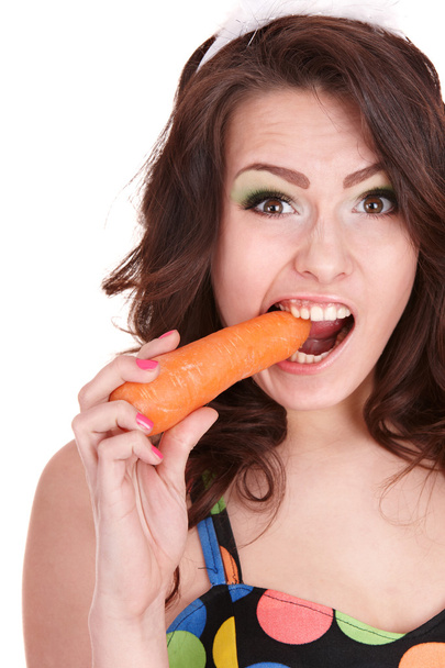 Face of girl eating carrot. - Фото, изображение