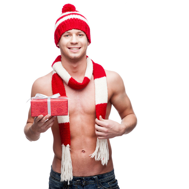 sexy macho holding red gift - Foto, imagen