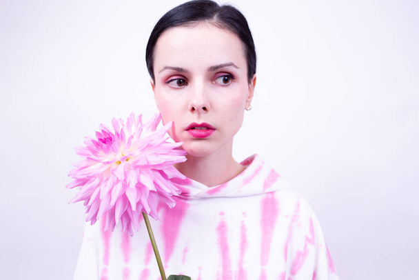 woman in pink holding a pink flower - Photo, Image