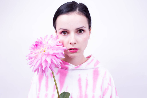 woman in pink holding a pink flower - Photo, Image