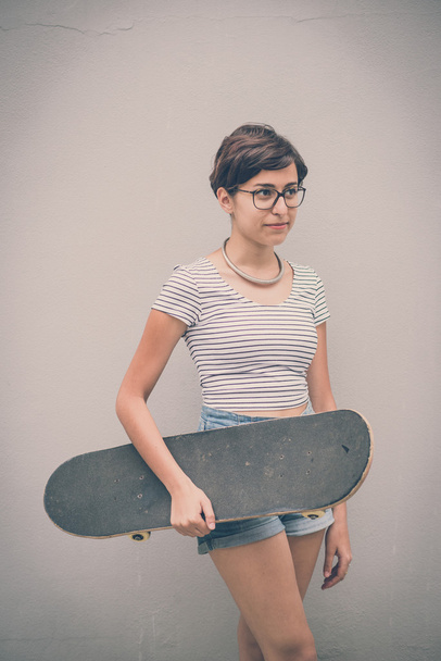 young hipster woman with skate - Φωτογραφία, εικόνα