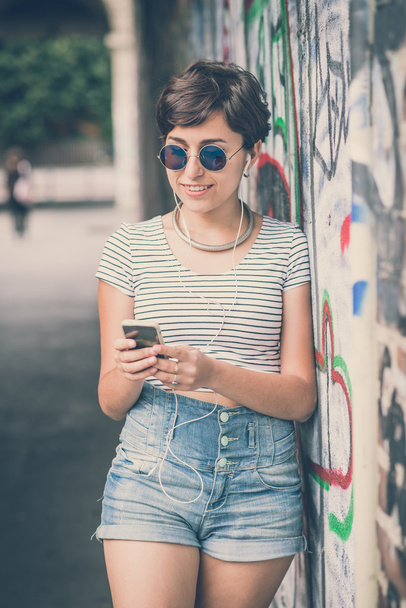 young hipster woman listening to music - Photo, image
