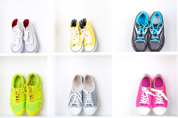 Colorful shoes on wooden shelves - Zdjęcie, obraz