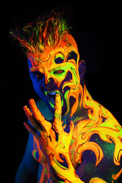 Body art glowing in ultraviolet light  - Foto, imagen