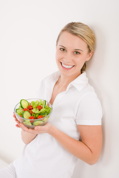 Healthy lifestyle - smiling woman with vegetable salad - 写真・画像