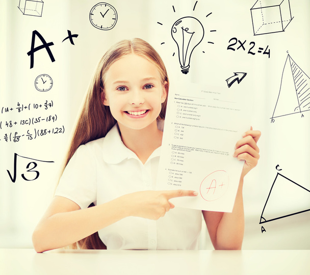 girl with test and A grade at school - Фото, зображення