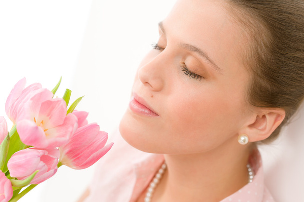 Fashion - young romantic woman smell spring tulips - Photo, Image