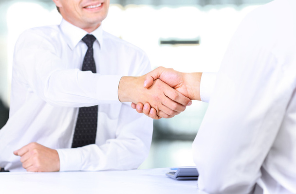 Close up image of business handshake at meeting. Partnership concept - Фото, изображение