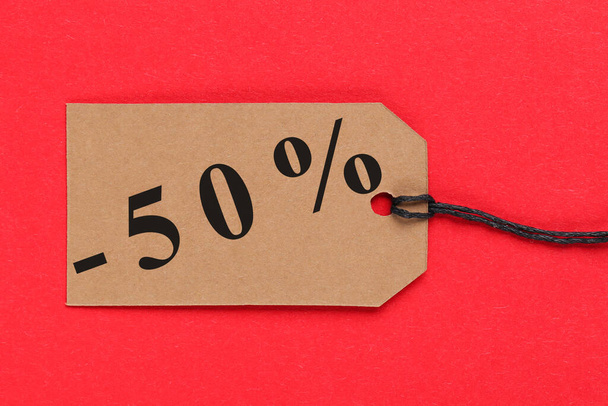 Sale tag with percents on red background - Zdjęcie, obraz