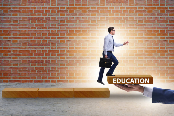 Education concept with businessman on steps - Photo, Image
