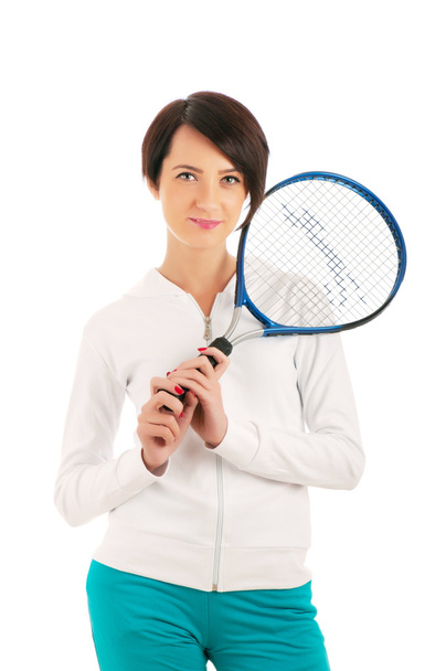 Mladá dívka s tenisovou raketou a bal izolované na bílém - Fotografie, Obrázek