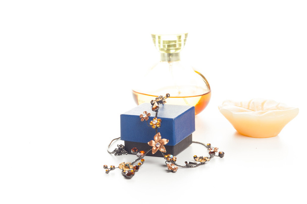 necklace perfume and candle - Foto, afbeelding