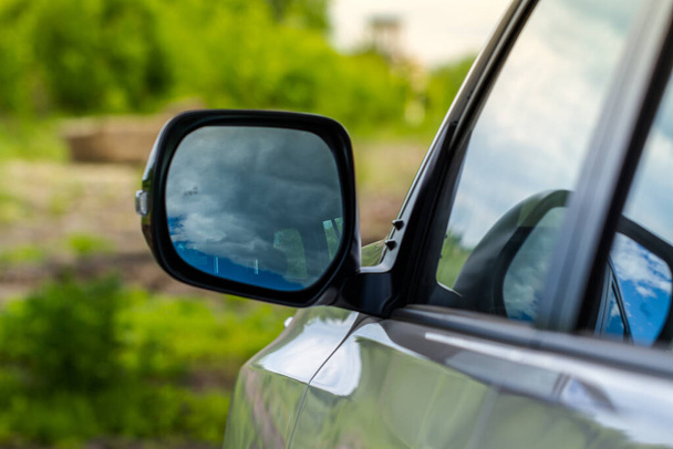 Rearview mirror of a modern car. Close up of modern car mirror. - Photo, Image