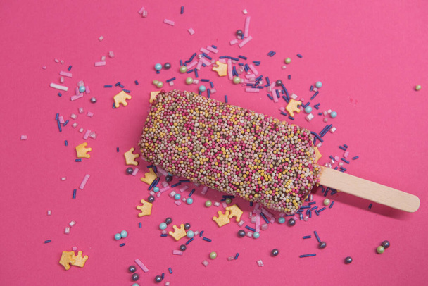 Ice cream on stick with colorful sprinkles - Foto, Imagem