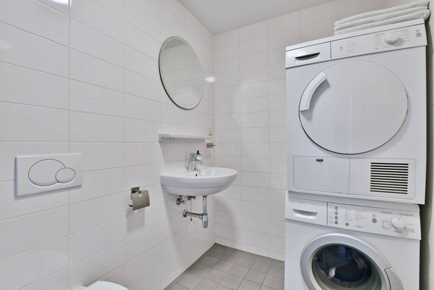 Bathroom with washing machine - Фото, изображение