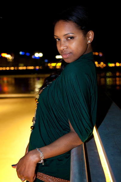Portrait of young black woman in city at night. - Fotó, kép