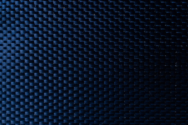 Сетка черная текстура. Материал темно-полиэфирного волокна для спортивной ткани или абстрактного ткачества фона. Синтетическая модель для рюкзаков и спортивного инвентаря - Фото, изображение