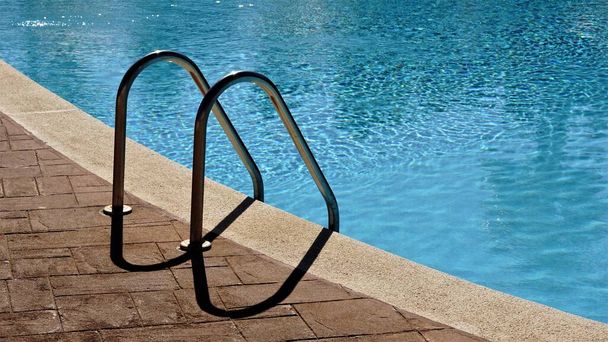 ladder to access a swimming pool - Photo, Image