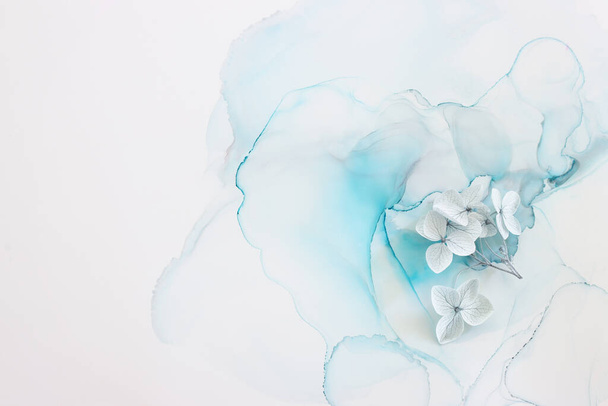 Creative image of pastel blue Hydrangea flowers on artistic ink background. Top view with copy space - Фото, зображення