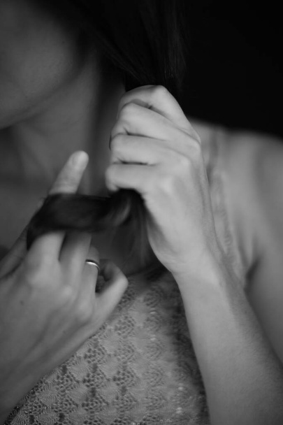 body details, female palms on a dark background, a beautiful fuzzy and unfocused image of hands and fingers - Фото, зображення