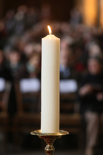 Mass in Saint-Eustache church. Candle. France.  - Photo, Image