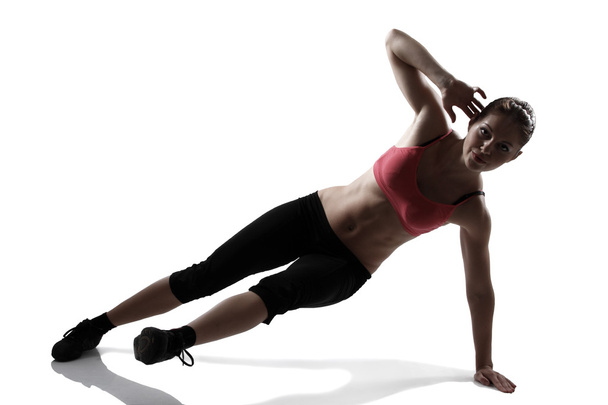 Sport woman doing abs and legs exercise - Valokuva, kuva