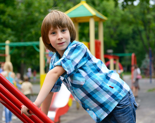 Boy playing on playground - Fotoğraf, Görsel
