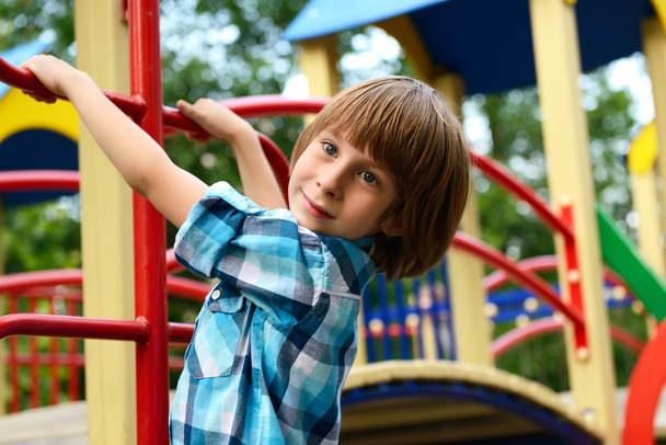 Boy playing on playground - Foto, immagini