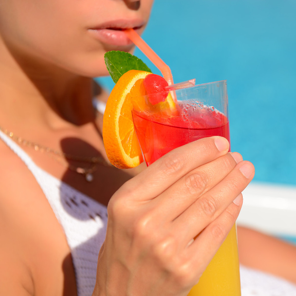 Woman drinking  cocktail - Фото, изображение
