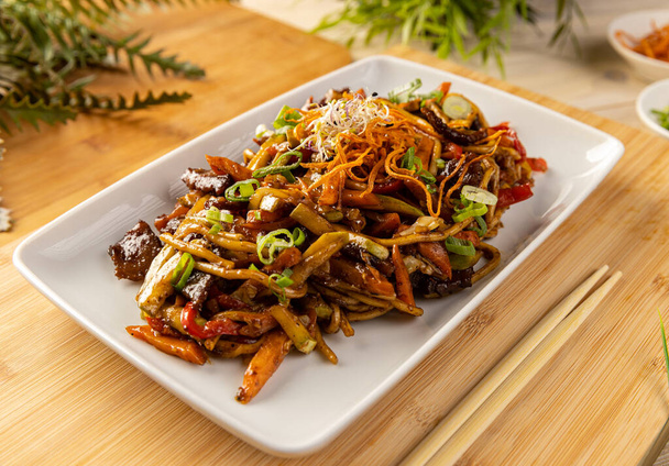 Delicious pork stir fried with noodles and vegetables - Photo, image