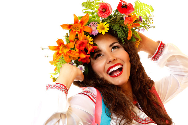Ukrainian woman in garland of flowers - Valokuva, kuva