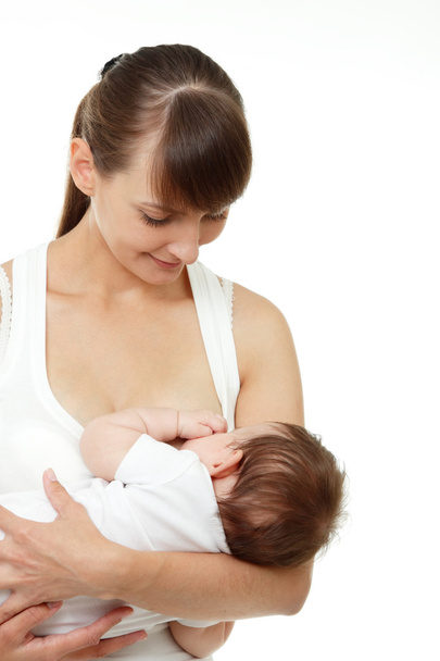 Young mother breast feeding her baby - Photo, Image